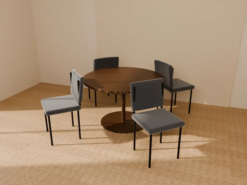 A round walnut meeting table with four graphite chairs