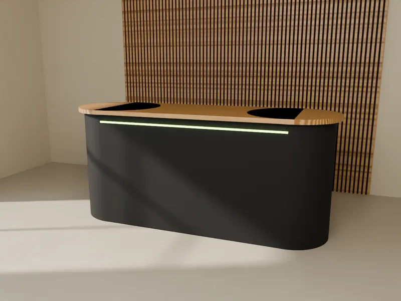 A graphite reception counter with a rounded oak top and a slatted wall